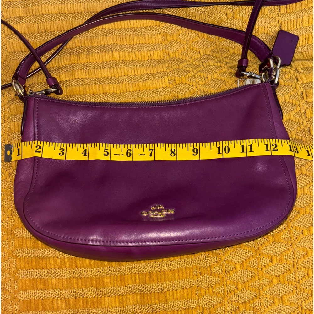 Coach Purple Crossbody Purse with removable strap. Can be worn on the shoulder.